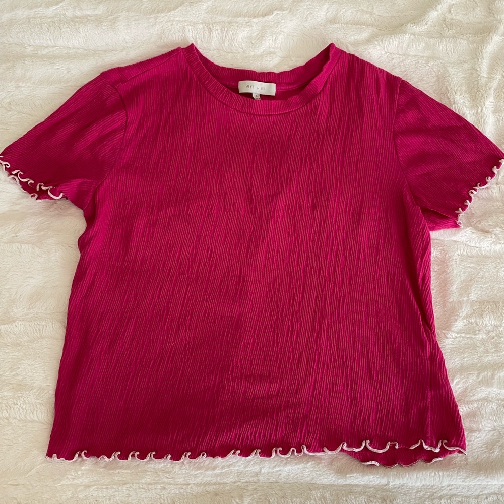 Pink blouse with white ruffle detail